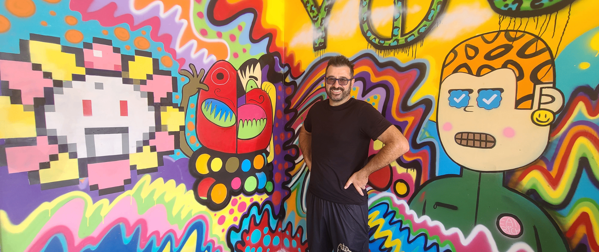 Fun House Garage mural with visitor