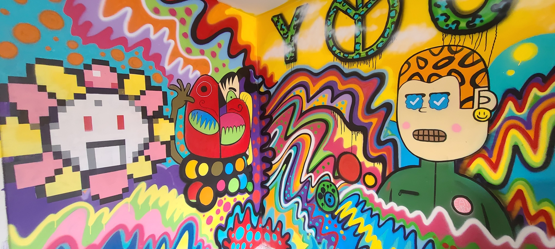 Fun House Garage mural — full wraparound view of psychedelic characters
