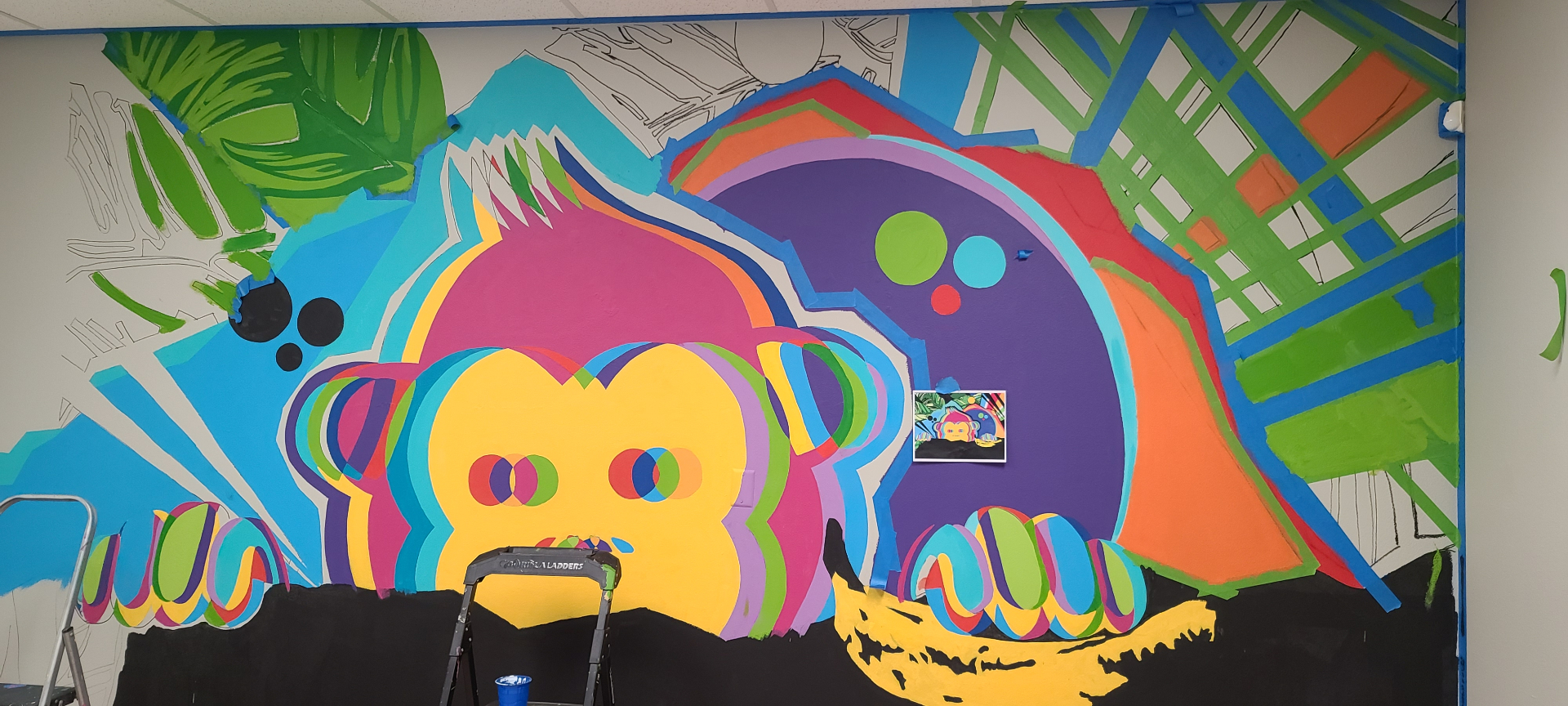 Red Chimp mural — mid-progress shot showing color blocking and layered outlines