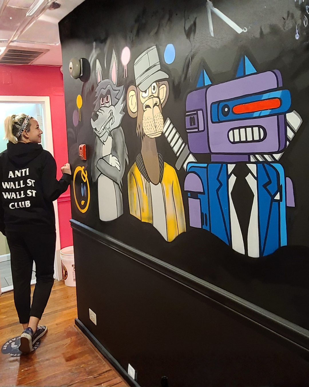 Up & Smoke DC mural — grayscale wolf, bored ape, and blue robot on black wall